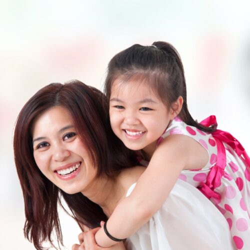 mom and her daughter with a perfect smile after invisalign