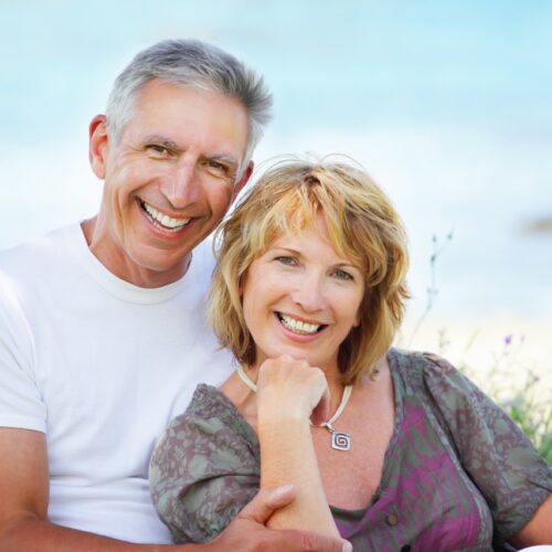 middle aged couple with a beautiful smile after teeth whitening